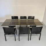 Smoked glass dining table with chrome legs, 1970s design by Roche Bobois.