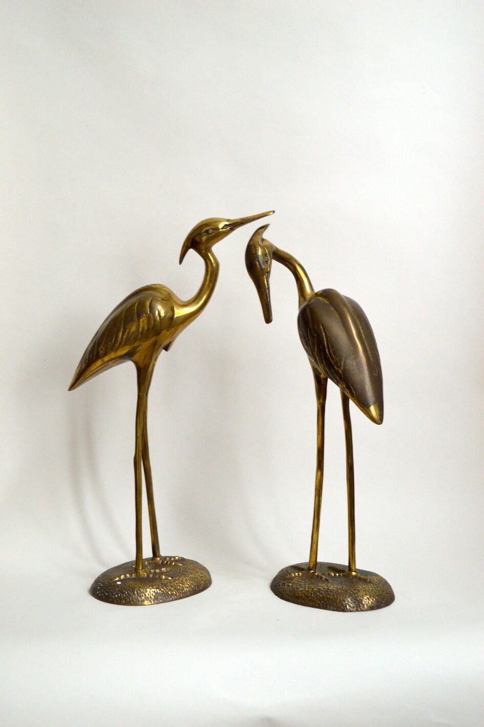 Brass herons couple