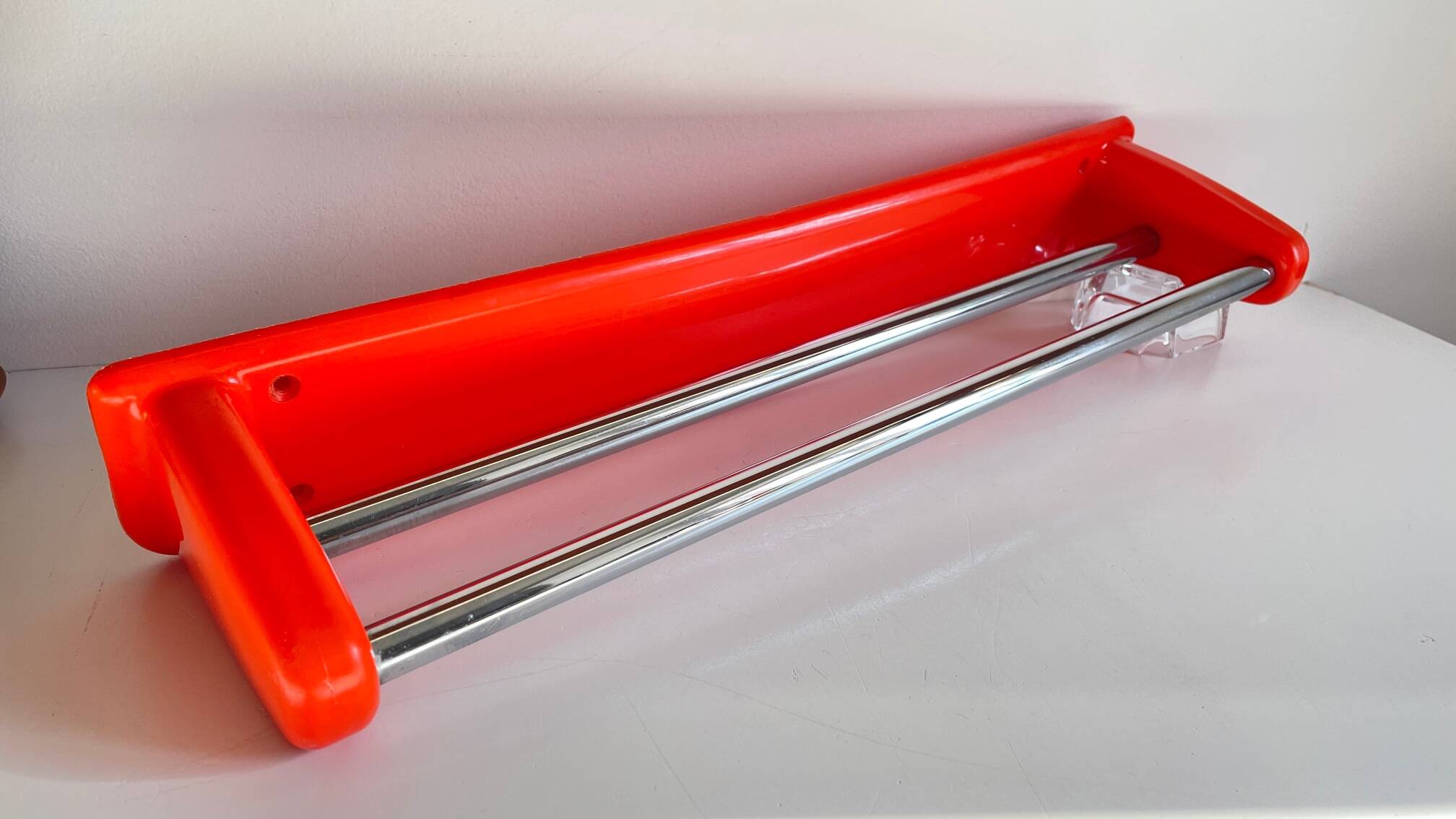 Orange towel rack by Syla from the 70s