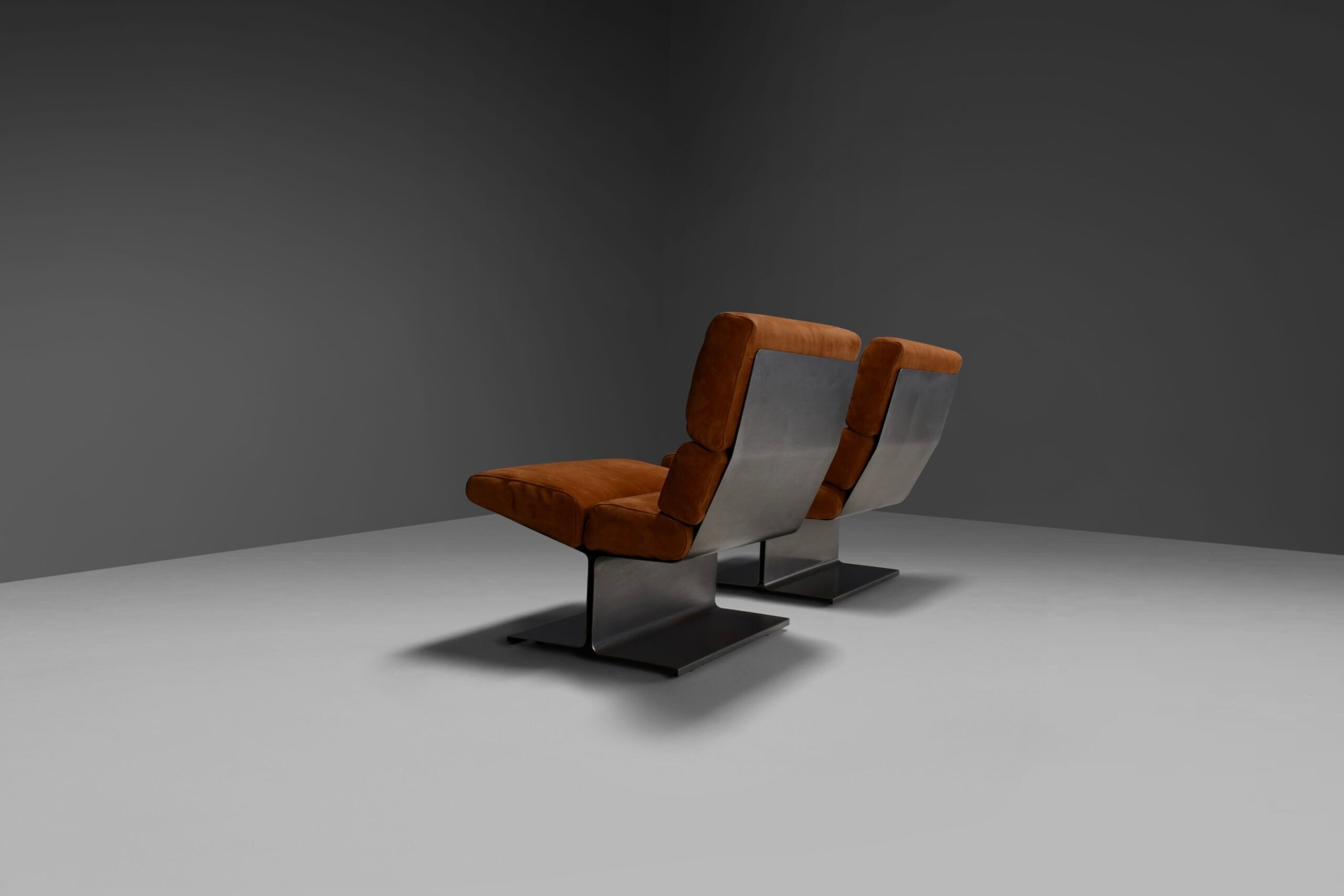 Very rare pair of leather and steel lounge chairs by Paul Geoffroy for Uginox