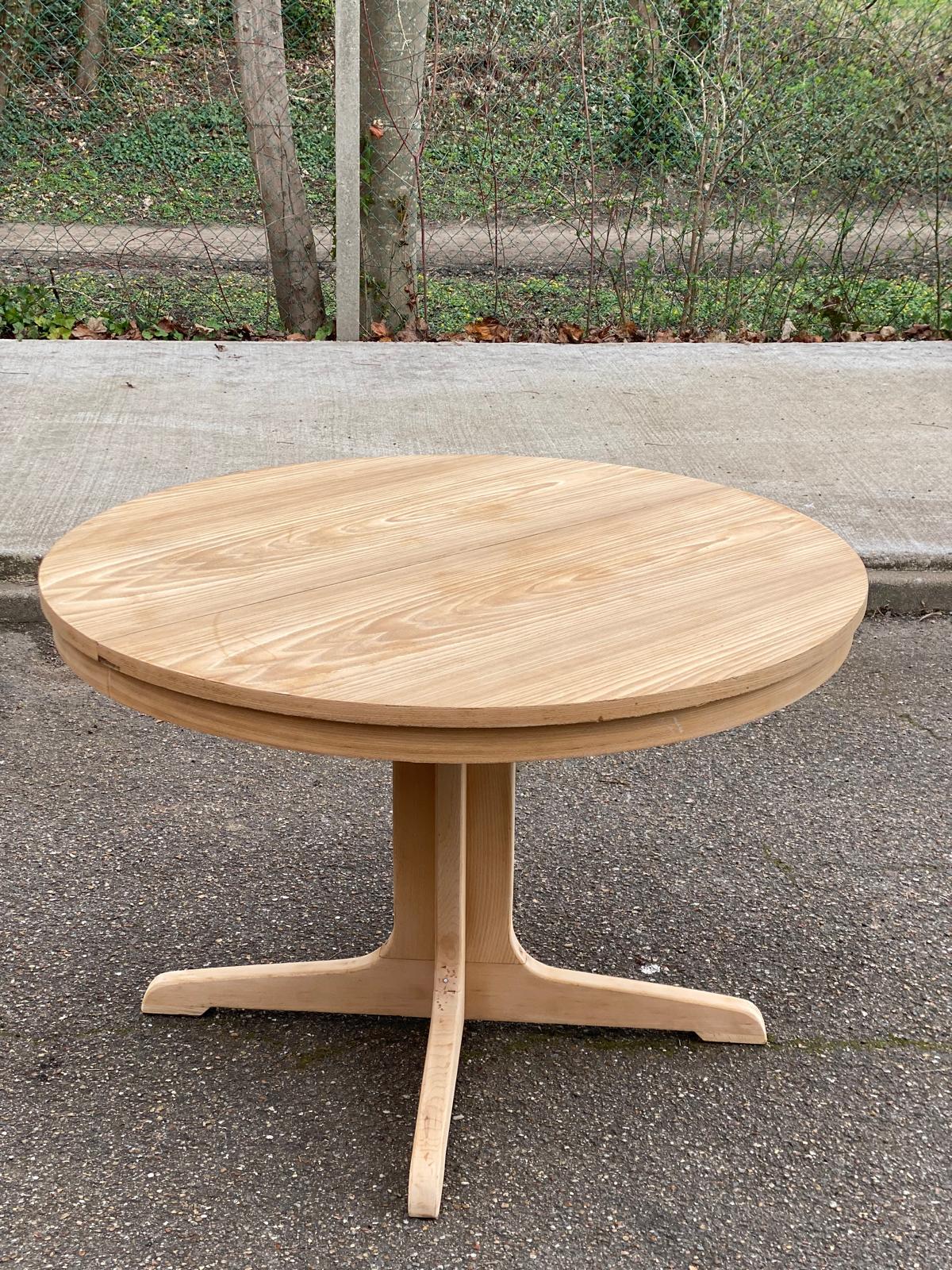 Scandinavian Baumann round extendable dining table with central leg, 115cm.