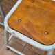 Set of four stackable industrial tubular metal and wood stools