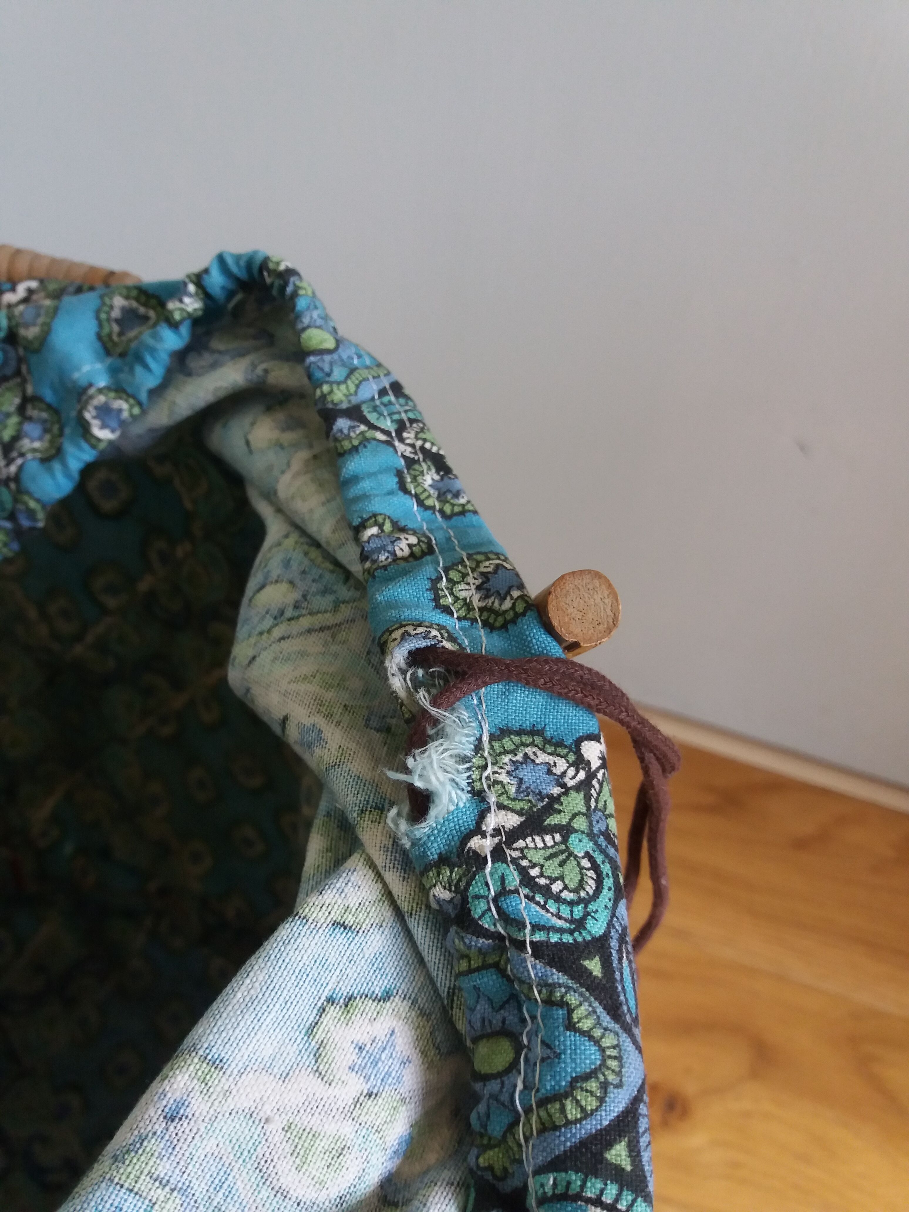 Wicker worker round basket with work, knitting