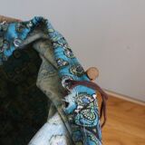 Wicker worker round basket with work, knitting