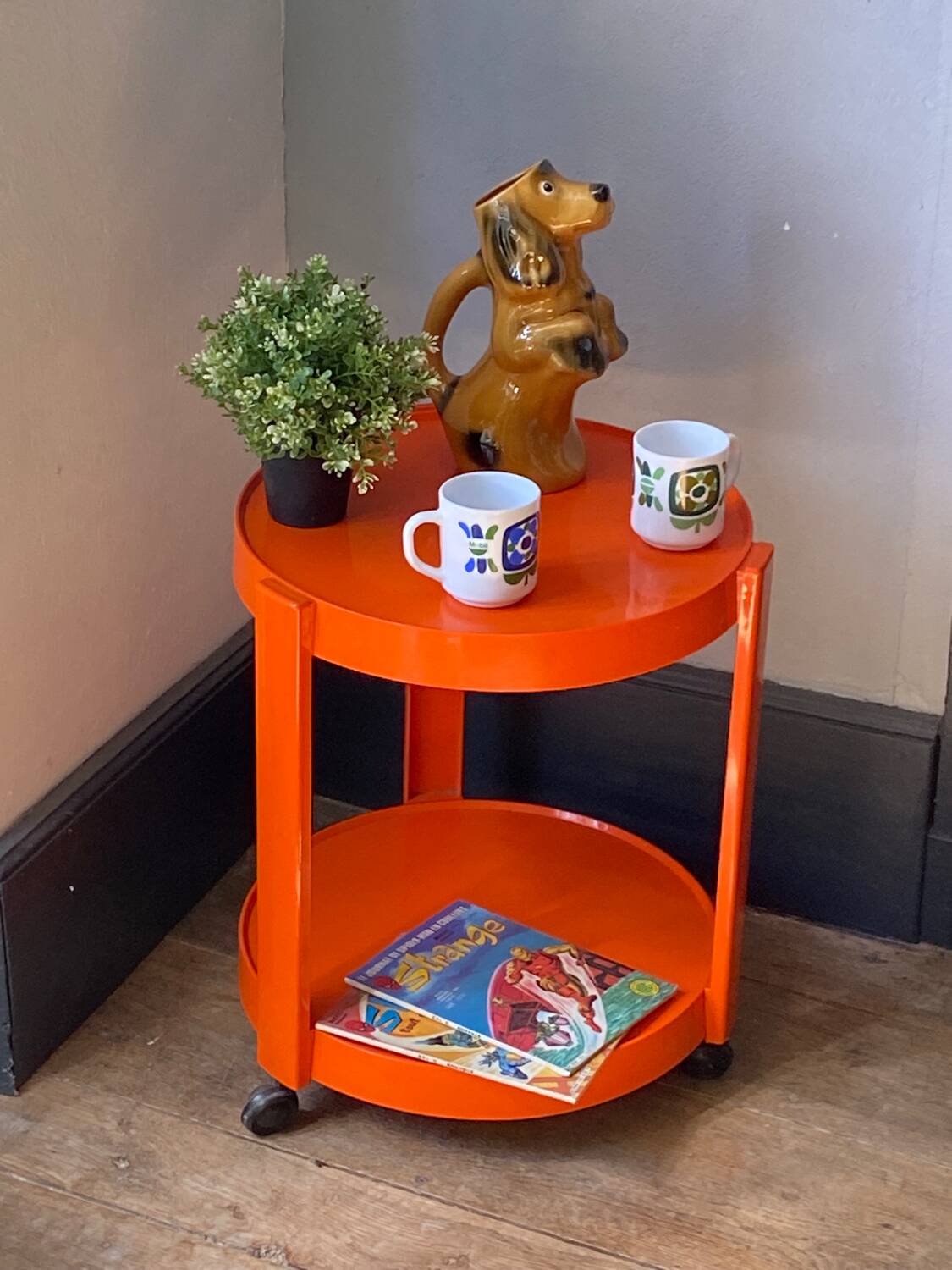 Vintage / designer / orange plastic rolling trolley,