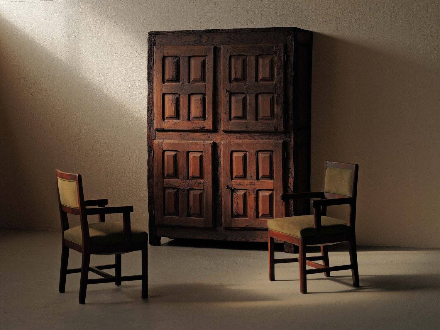 Pair of modernist armchairs in solid oak, France, circa 1940.