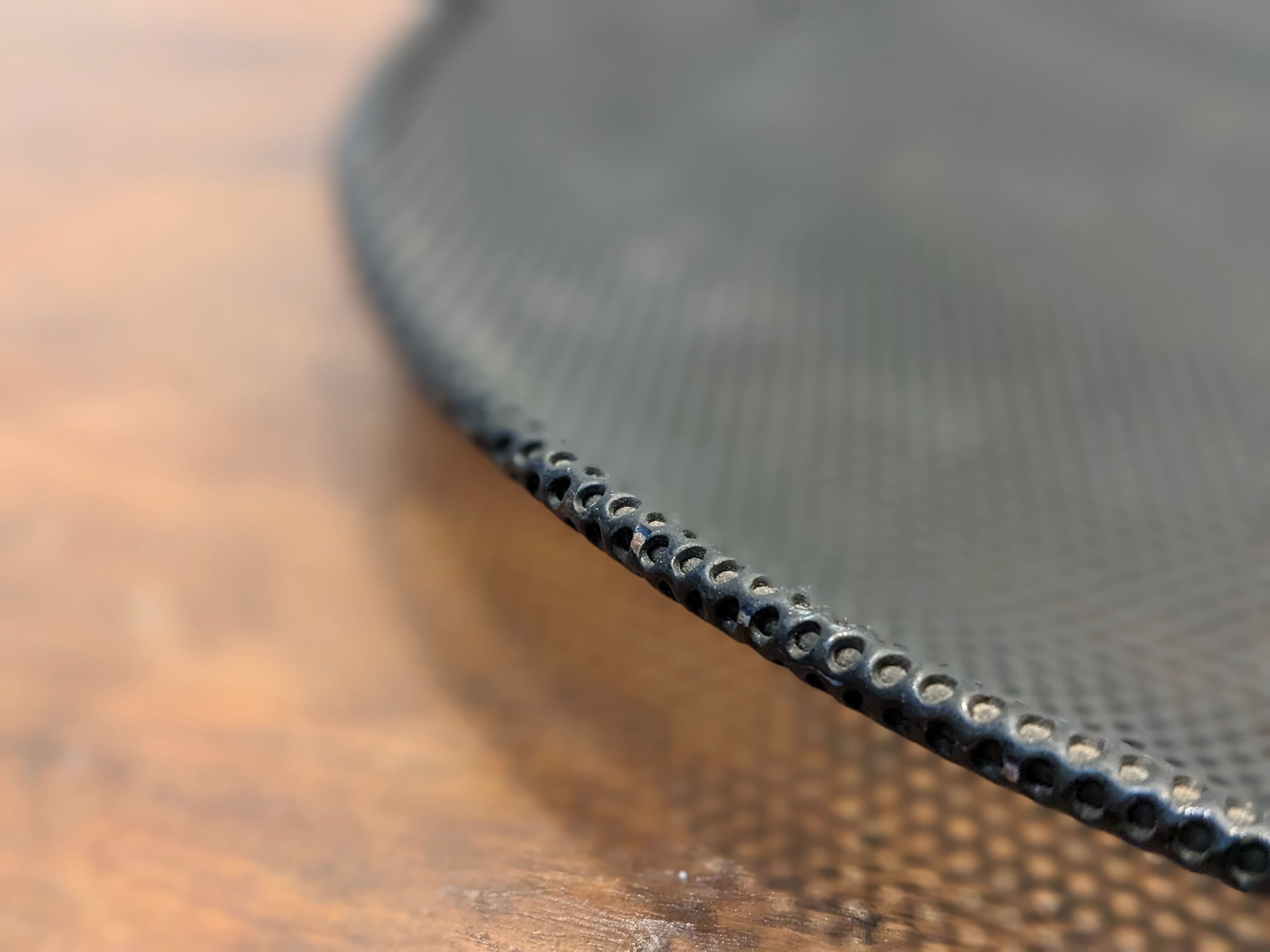 Black metal basket by Mathieu Mategot