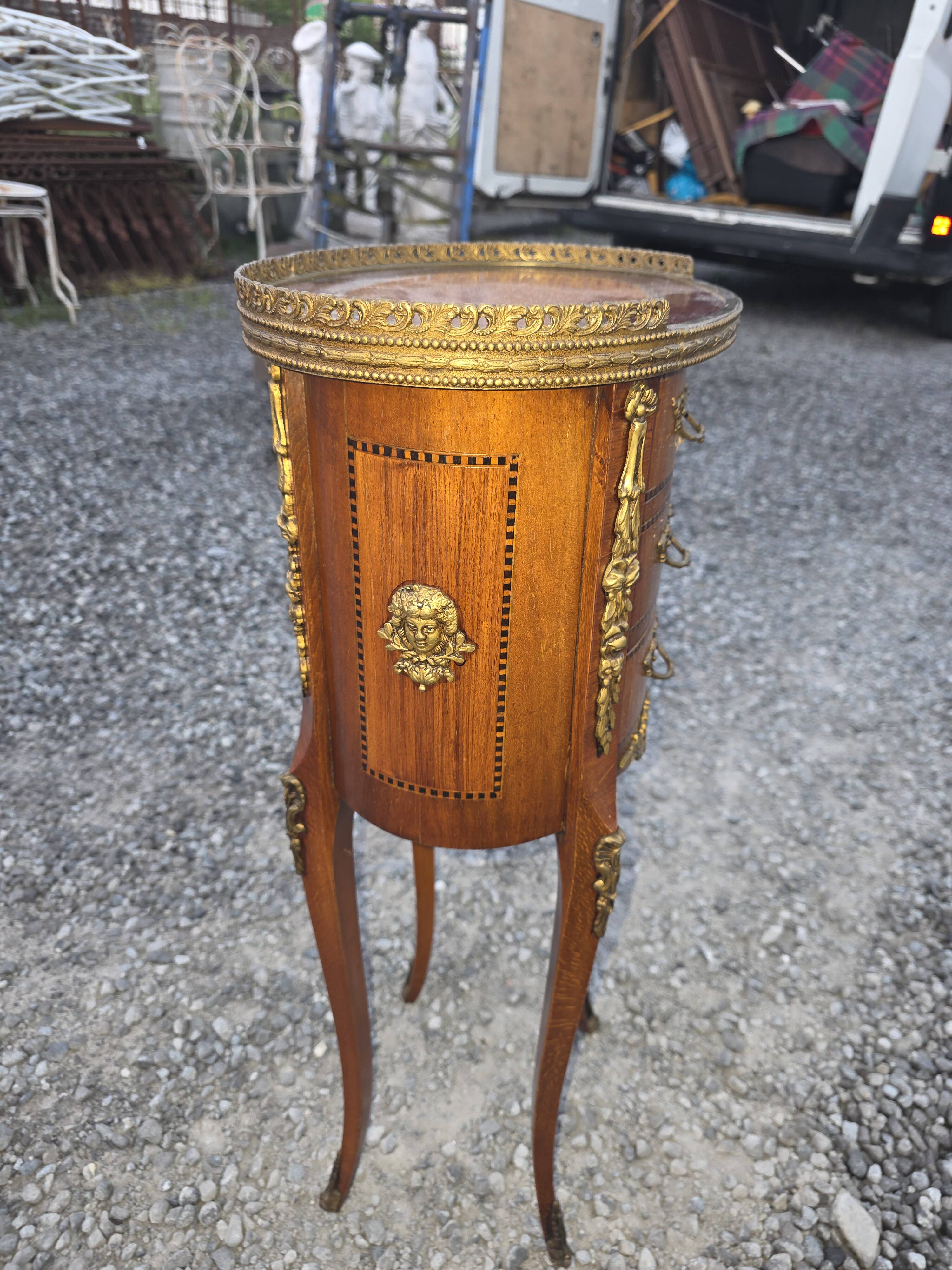 Oval bedside table in Louis XV style with marquetry.