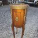 Oval bedside table in Louis XV style with marquetry.
