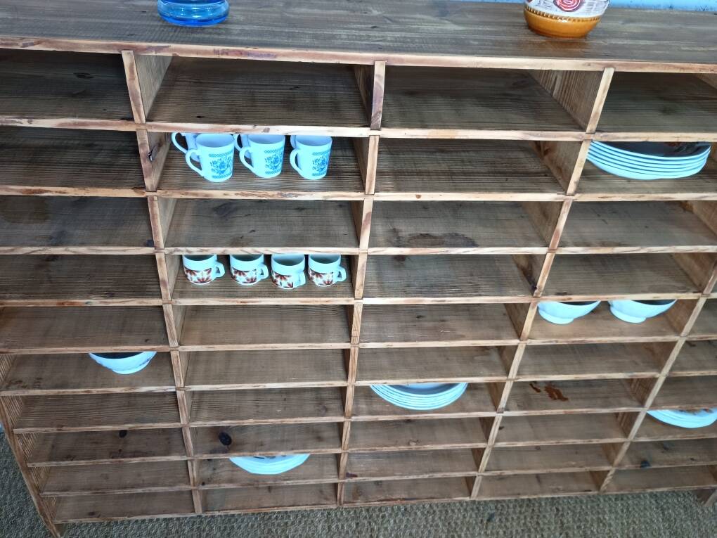 Wooden sorting cabinet with 50 compartments.