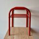 Vintage side table in red tubular steel - smoked glass window - 1980s