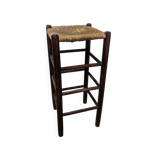 High wooden stool and straw