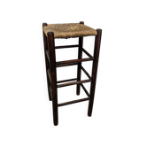 High wooden stool and straw