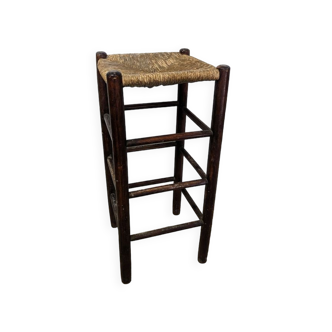 High wooden stool and straw