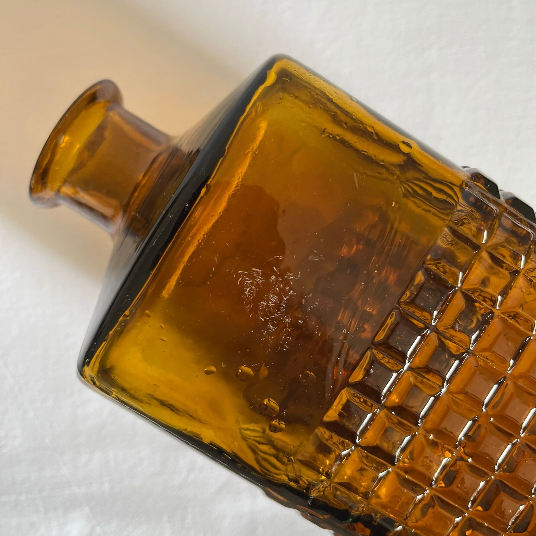 Amber glass and wood bottle