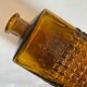Amber glass and wood bottle