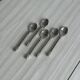 5 small twisted silver metal teaspoons