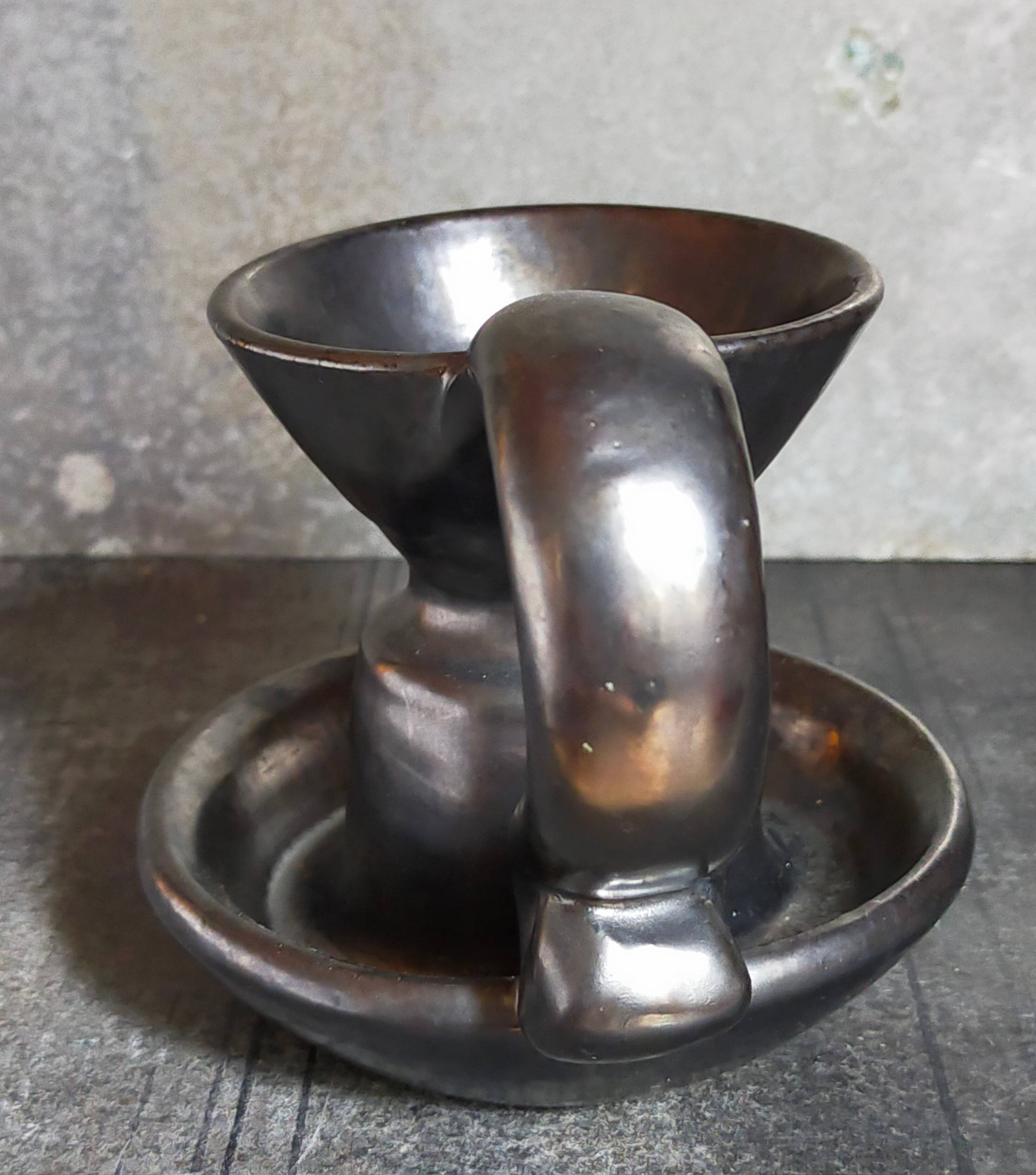 1950s iridescent black ceramic hand candle holder