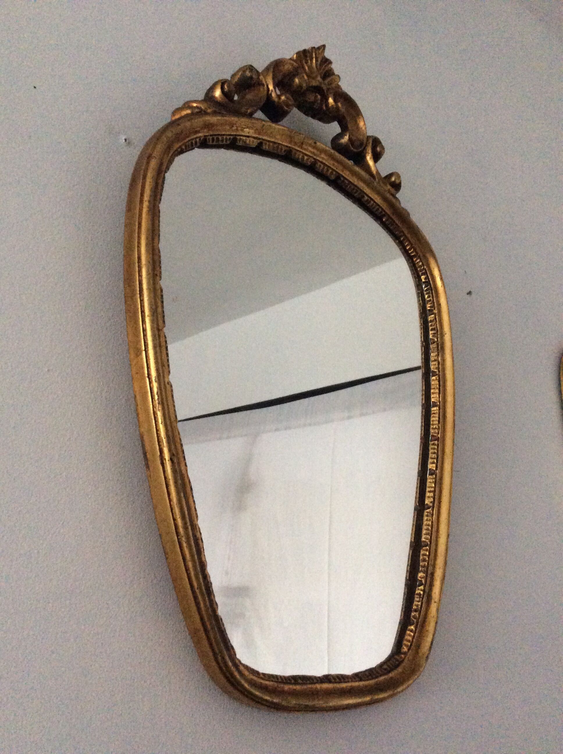 Old vintage mirror in gilded wood