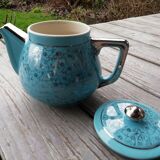 Semi blue teapot of silver flowers