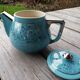 Semi blue teapot of silver flowers