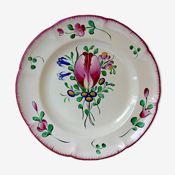 Eastern earthenware plate with floral decoration centered with a tulip