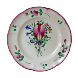 Eastern earthenware plate with floral decoration centered with a tulip