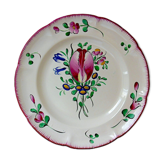 Eastern earthenware plate with floral decoration centered with a tulip