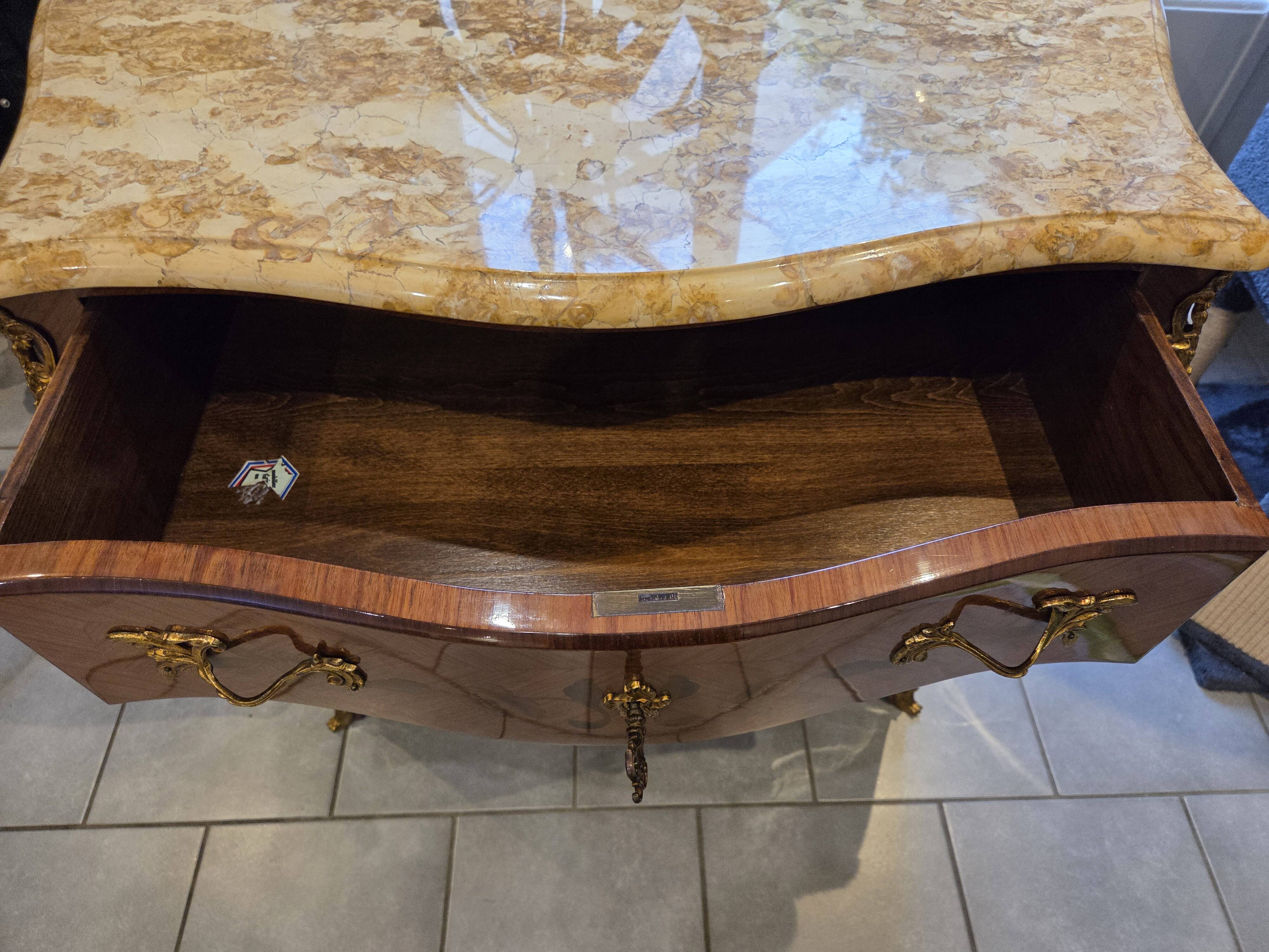Louis XV style commode with marquetry and marble.