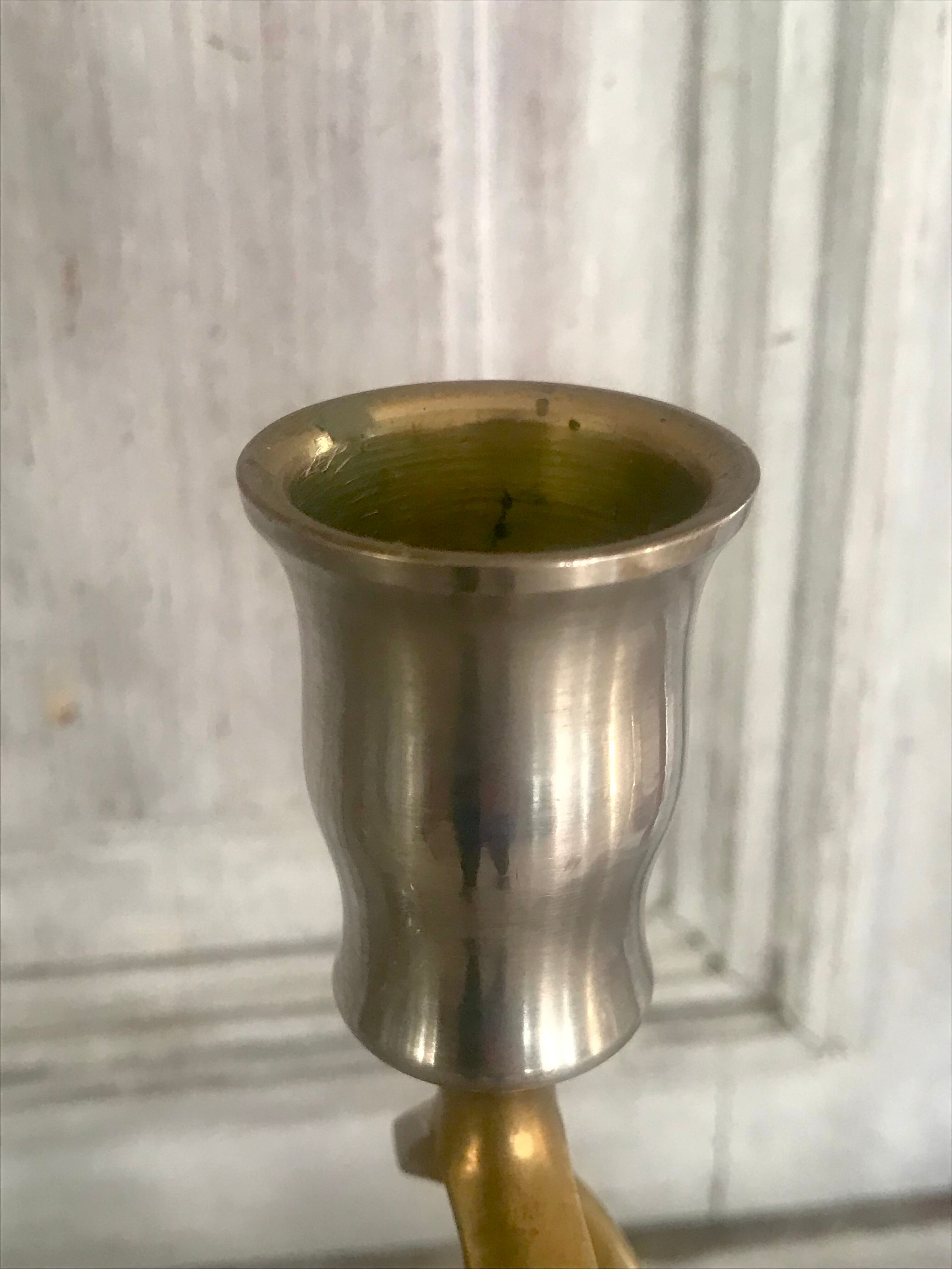Pair of twisted brass candle holders