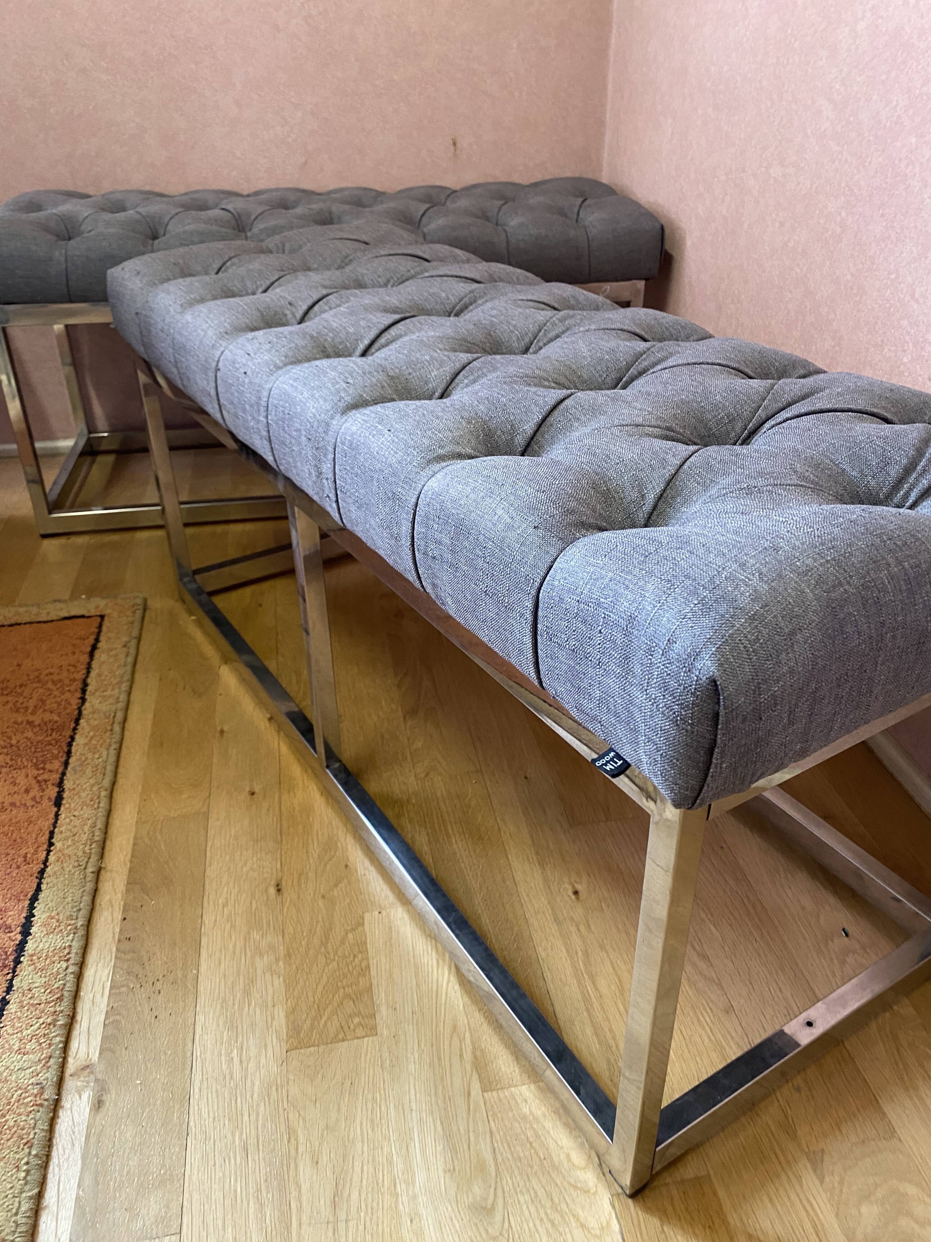 Pair of benches in chrome metal and padded gray fabric