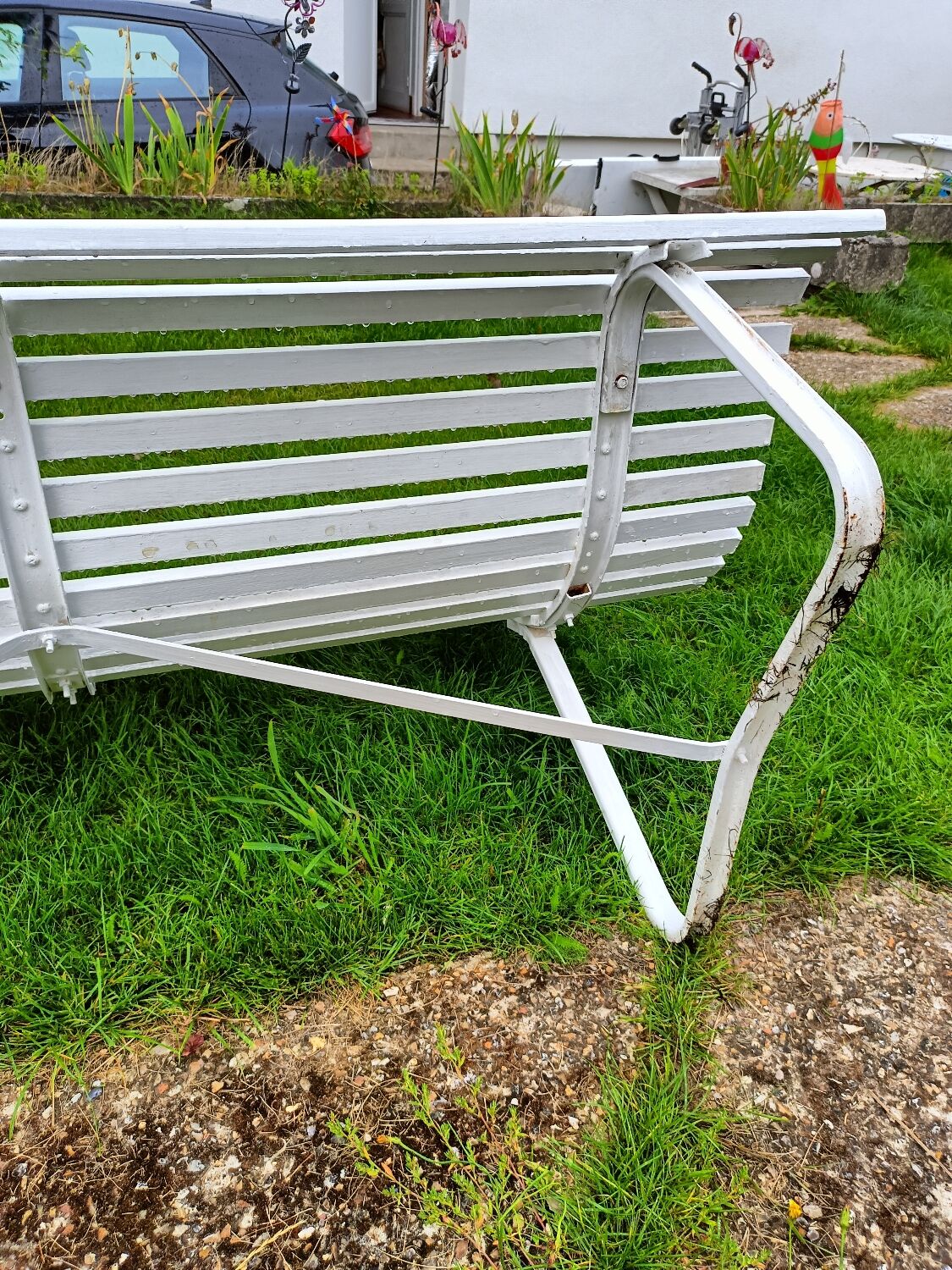 Antique garden bench with metal legs