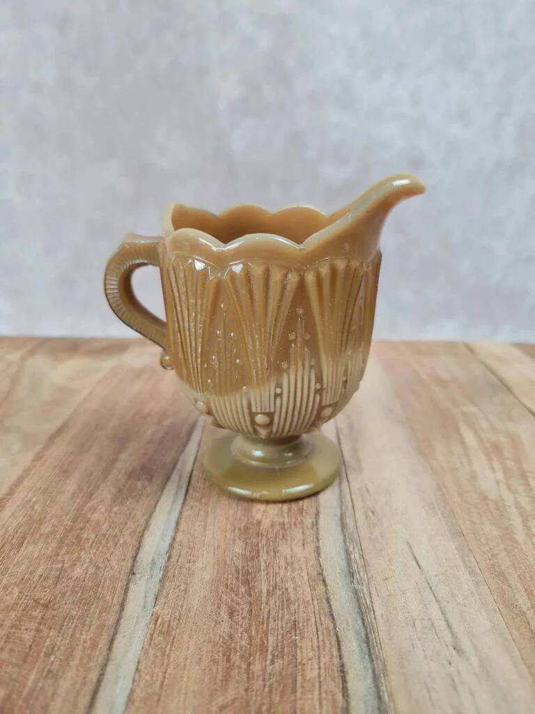 Small antique pressed glass jug in honey colour – moulded decoration