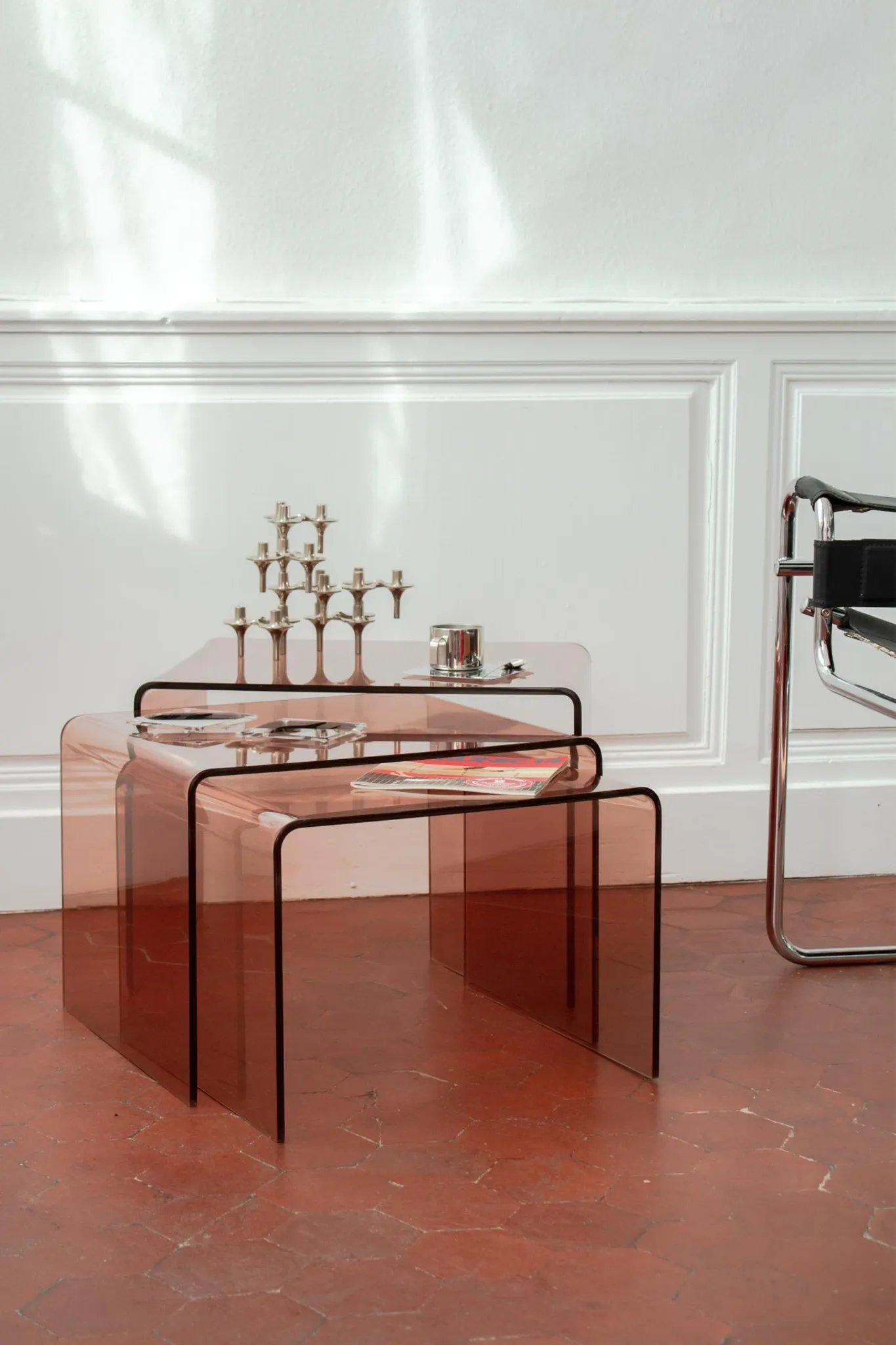Vintage trio of nesting tables in smoked plexiglass by Michel Dumas, year