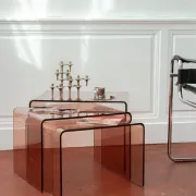 Vintage trio of nesting tables in smoked plexiglass by Michel Dumas, year