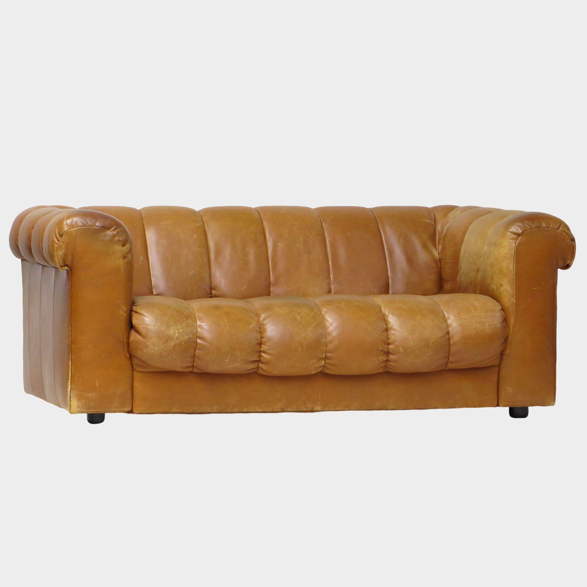 Mid century 2.5 seater sofa in thick cognac buffalo leather, 1970s.