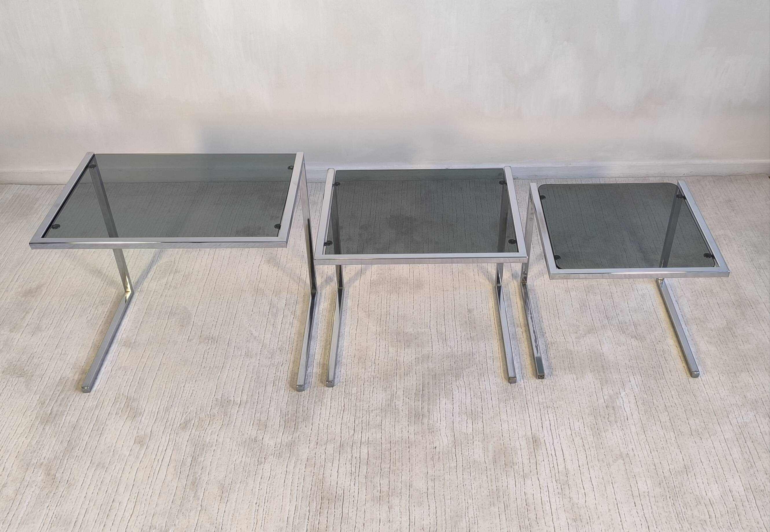 Set of 3 vintage nesting tables in chrome and smoked glass, Roche Bobois style.