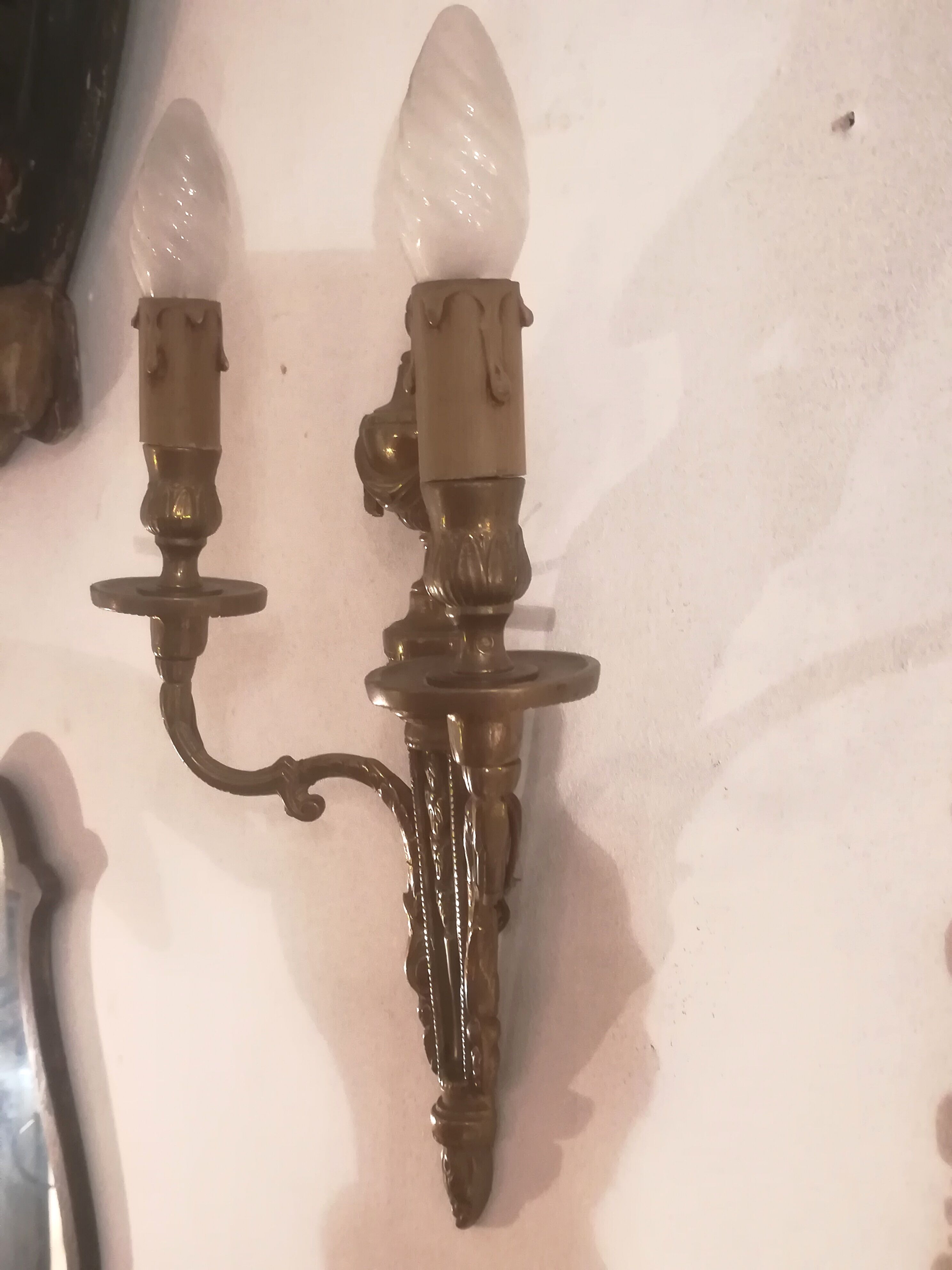 Pair of Louis XVI style sconces in gilded bronze