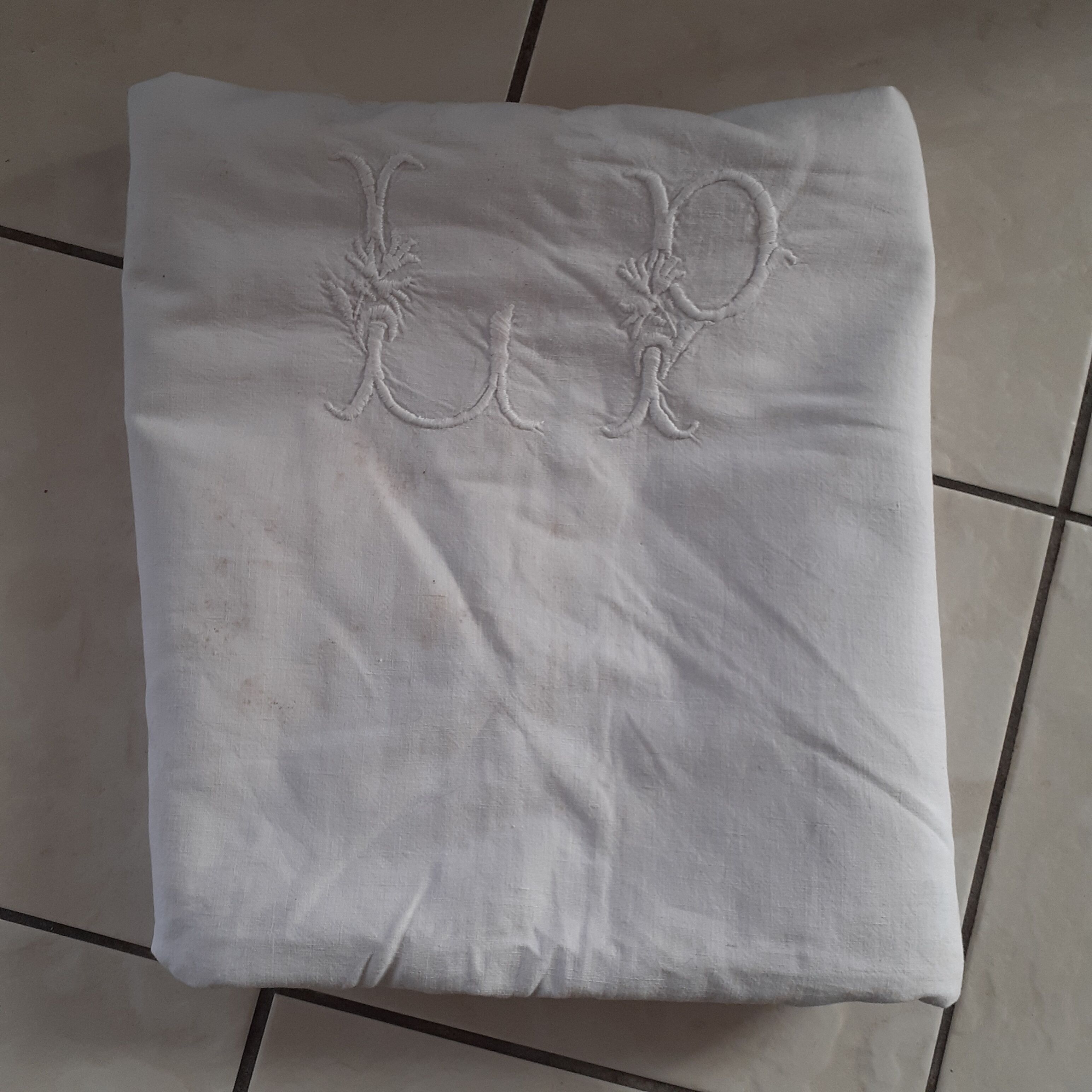 Old sheet quite thick with monogram.