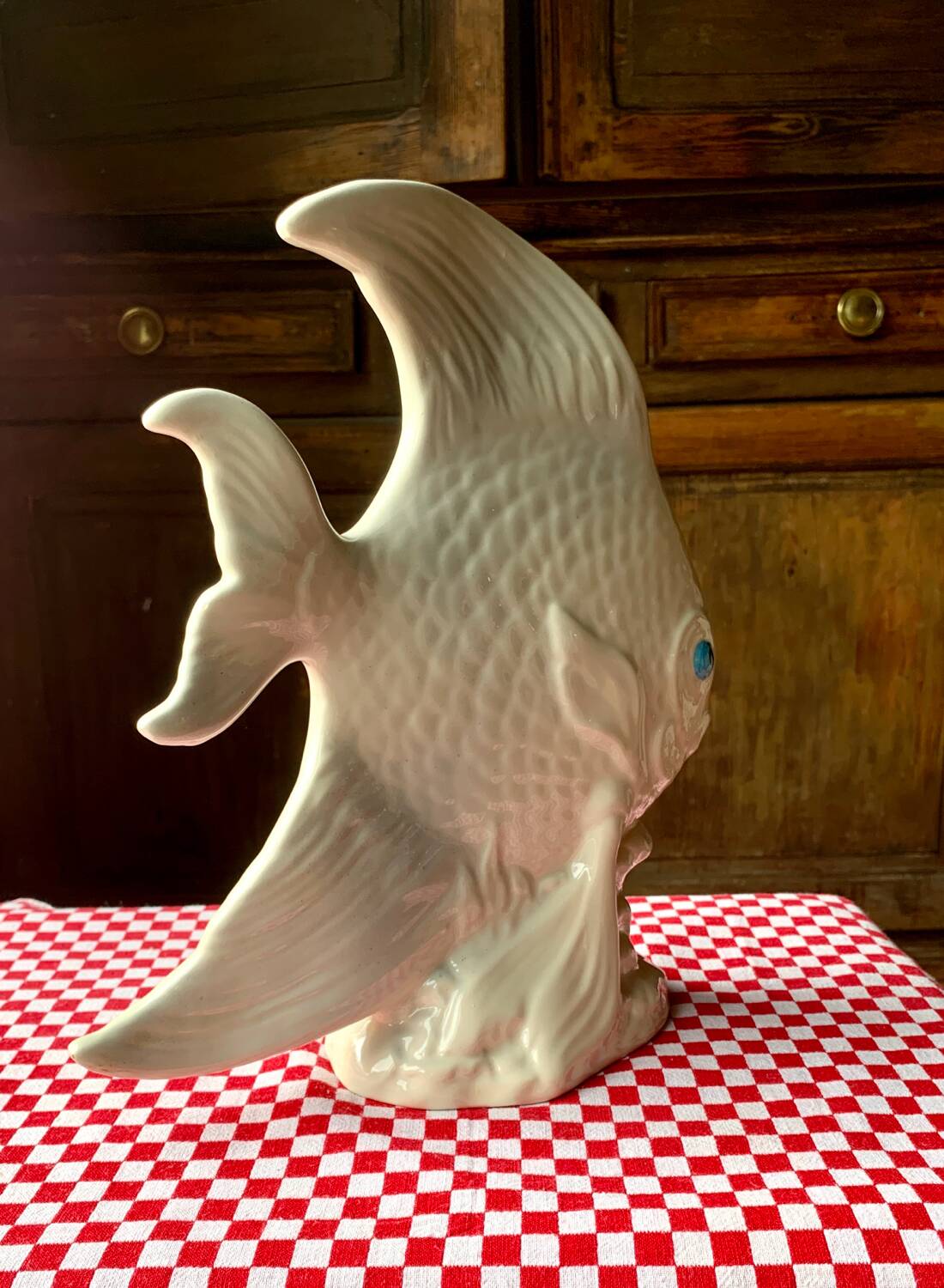 Large white ceramic fish to place.