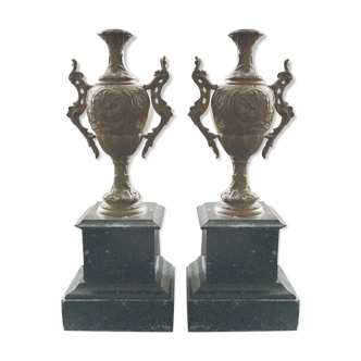 Pair of marble and regulated candlesticks