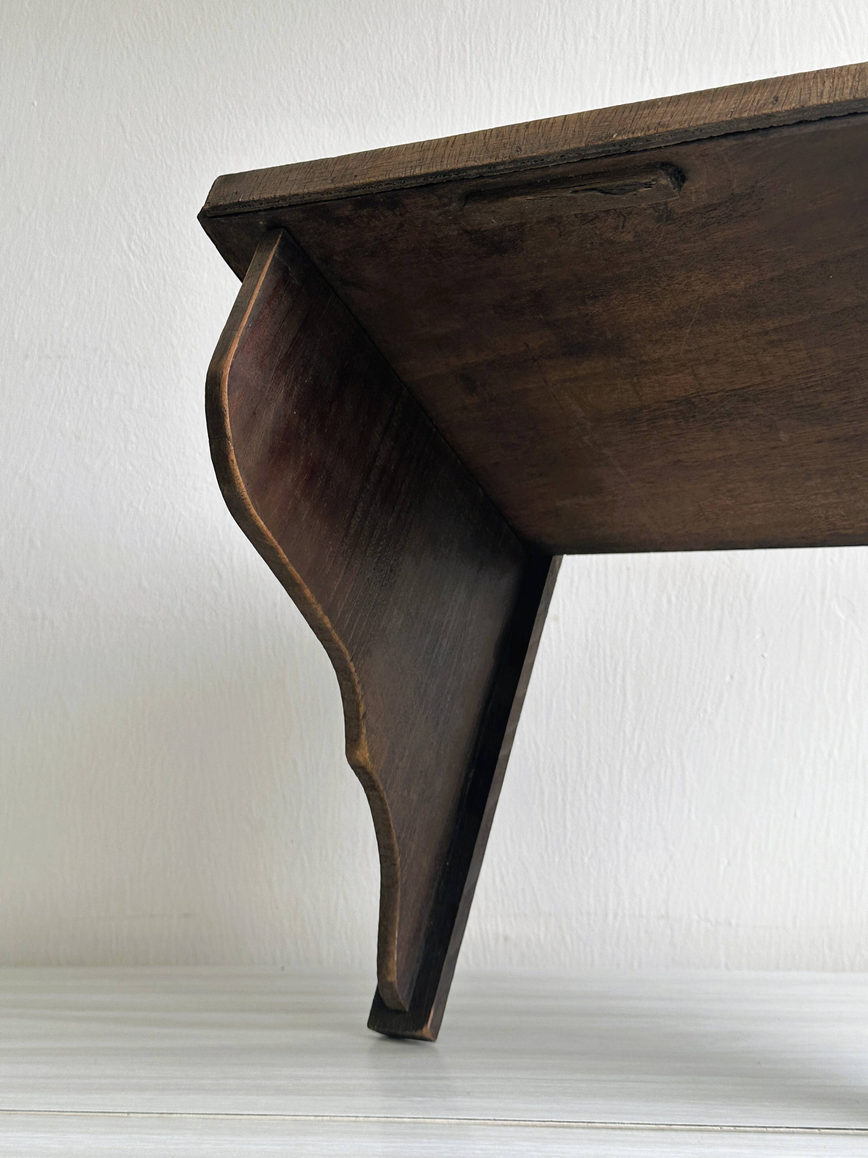 Antique wooden wall shelf.