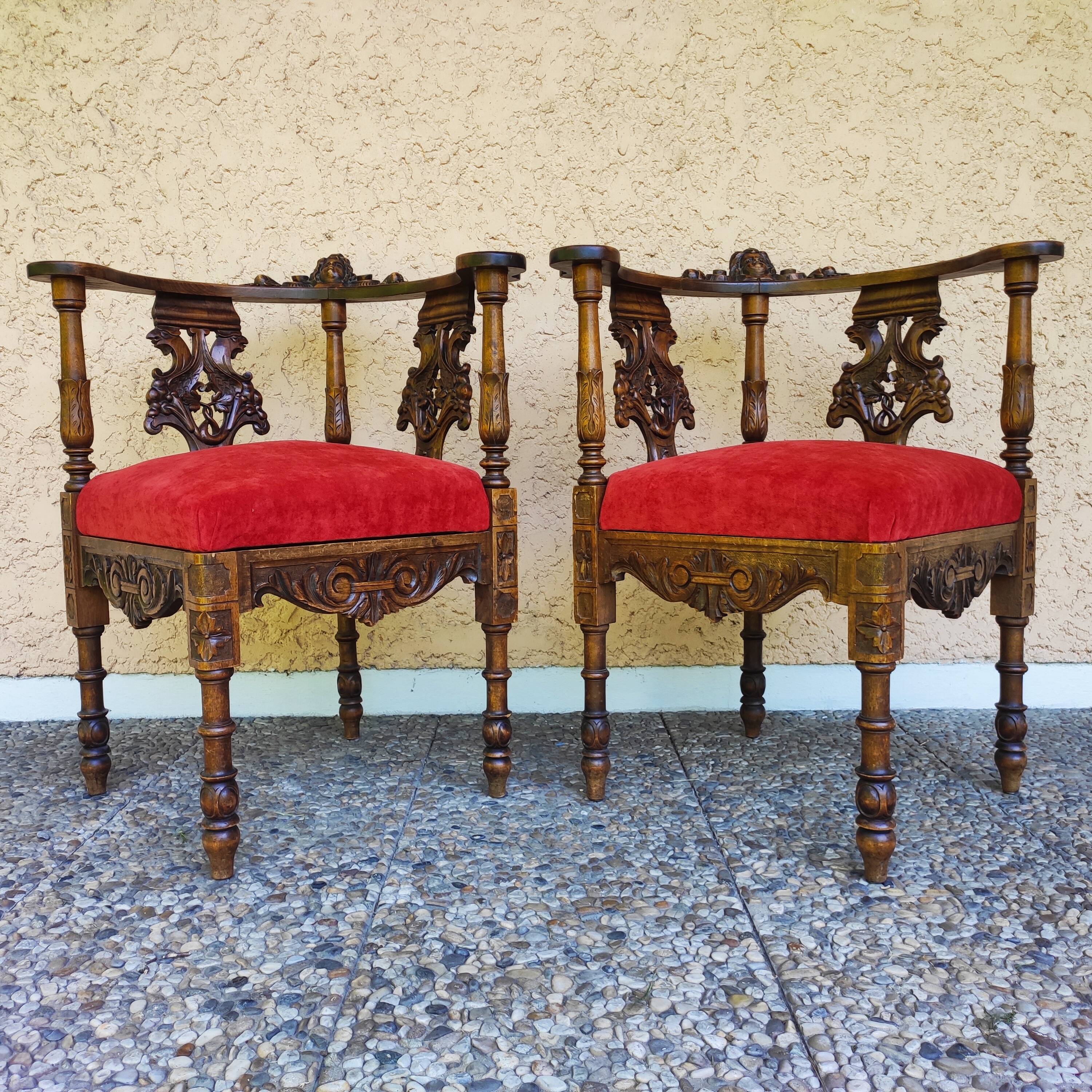Pair of neo-Renaissance Henri II corner armchairs in carved wood, 19th century.