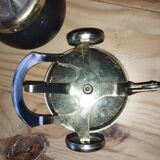 Original vintage ashtray on a small wheeled stand.