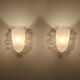 Wrought iron pocket wall sconces featuring a frosted amber glass / metal frame