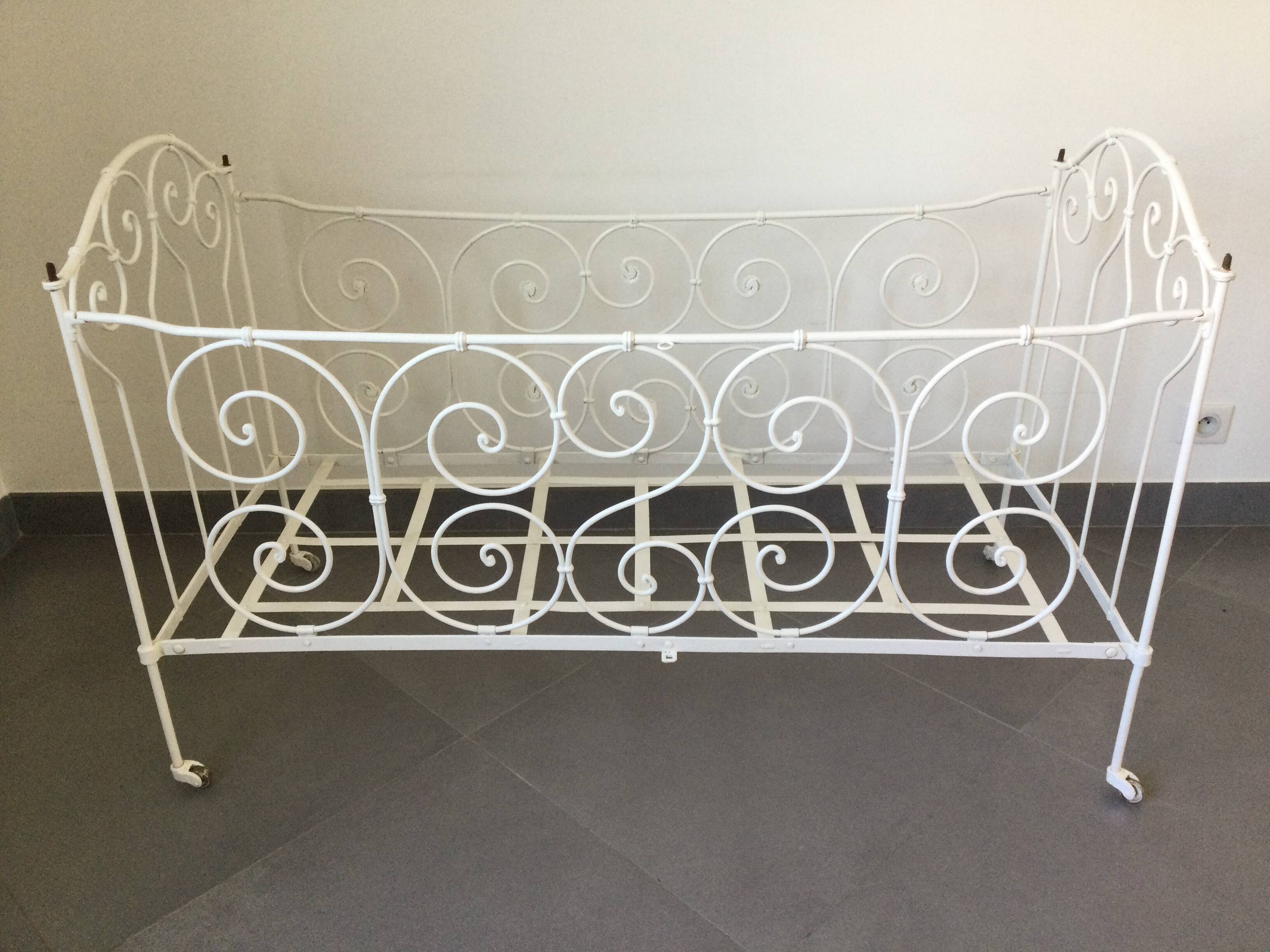 White wrought iron folding bed
