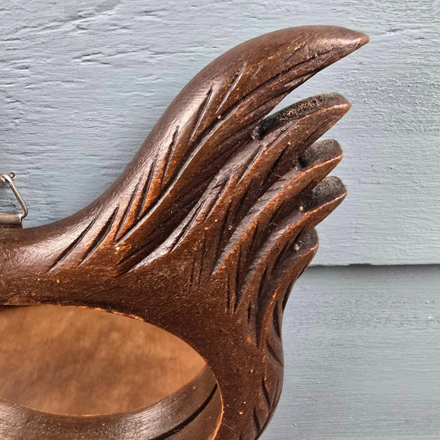 Vintage carved wooden chicken-shaped wall mirror.