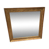 Old 19th century mirror in wood and gilded stucco