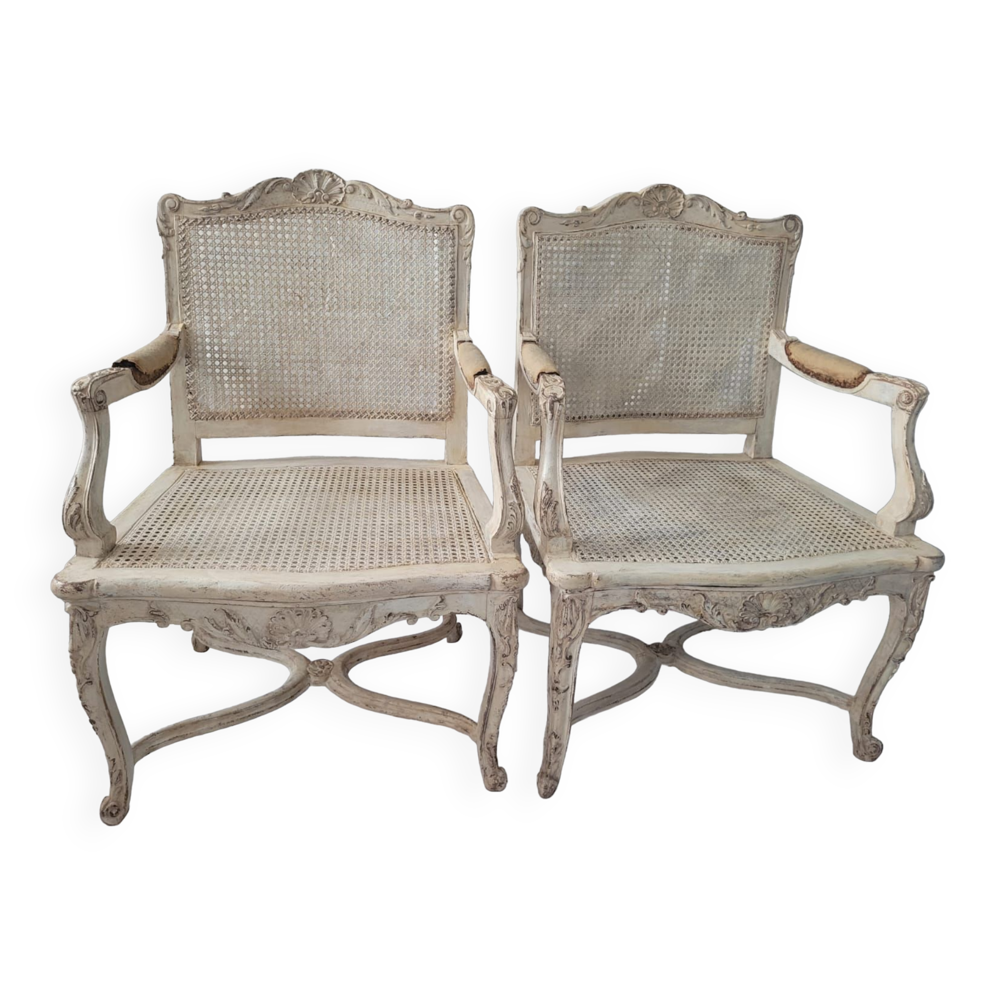 Pair of regency armchairs; canes; white lacquered 19th century