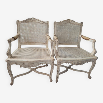 Pair of regency armchairs; canes; white lacquered 19th century